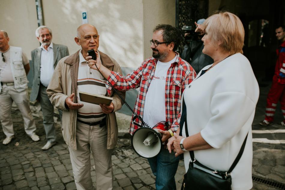 group of people talking in a megaphone