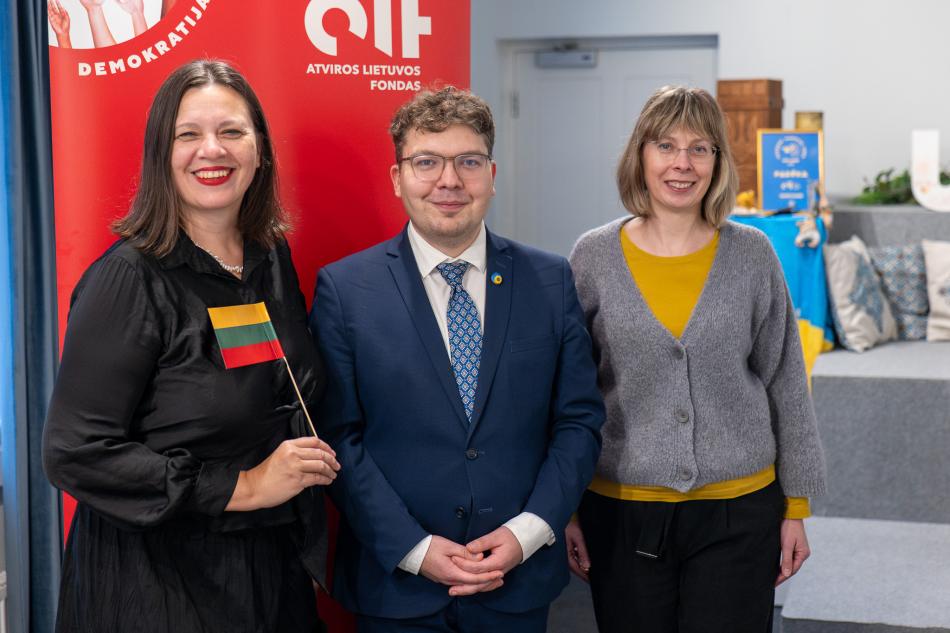 three people smiling